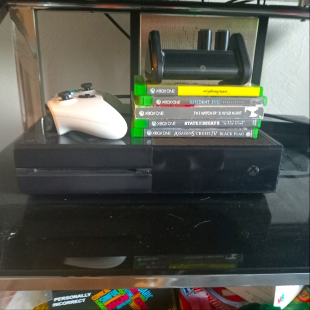 One Black Console with Controller and Games